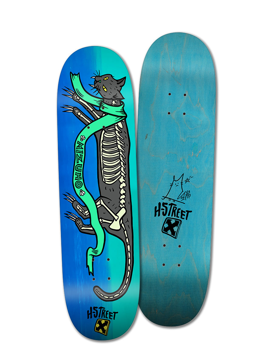 Two turquoise skateboard decks: the Woodchuck THE MIZUHO HIDDEN CAT deck with a cartoon black cat and teal “Mizunuchi” banner, and an H-Street Alpha Girls Hidden Cat skateboard with logo and small cat sketch.