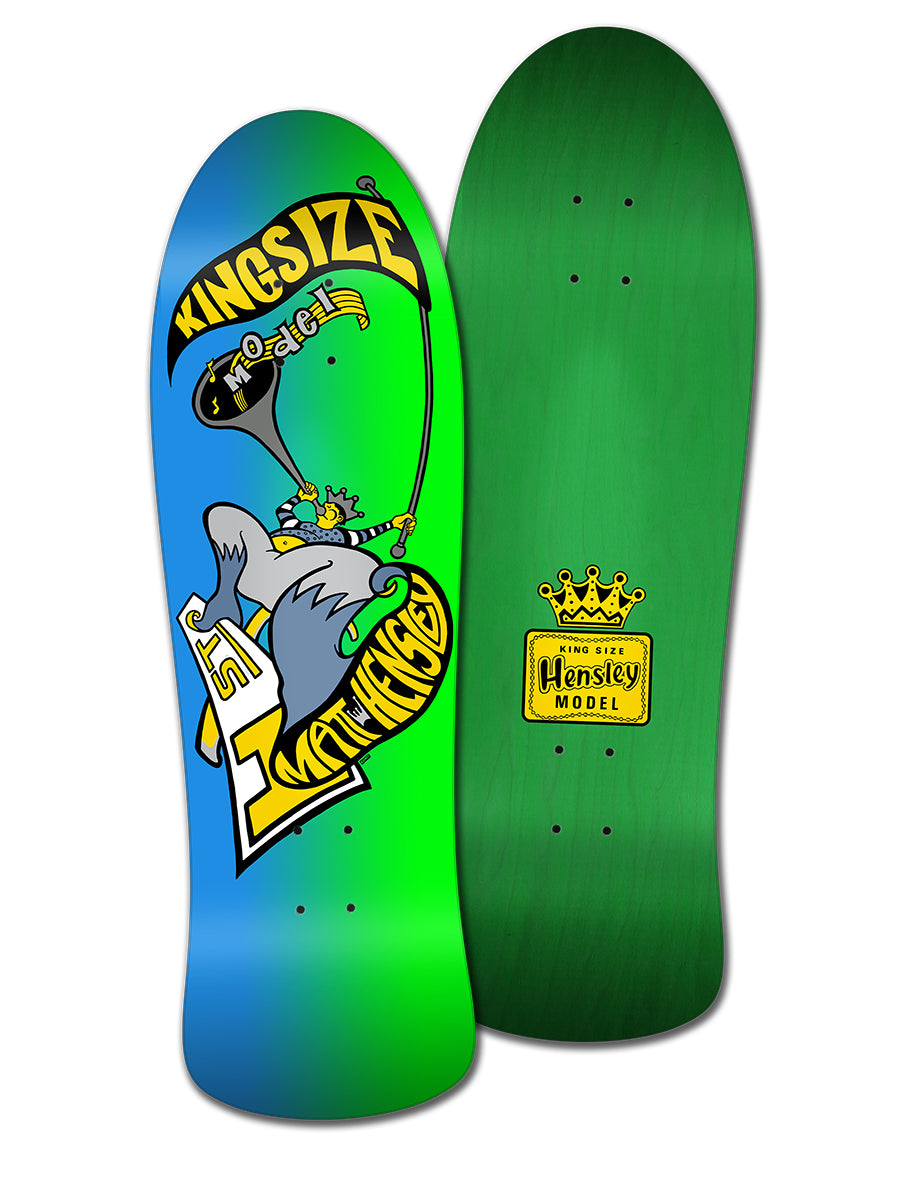 Two skateboards: one Legend Skates MATT HENSLEY KINGSIZE HORNBLOWER G SERIES with a blue-green gradient and cartoon king mouse, the other solid green with a yellow Matt Hensley Pro Model badge.