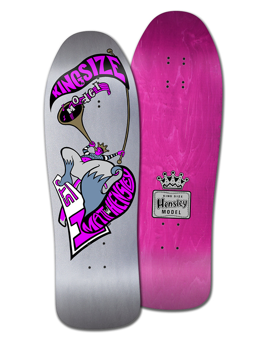 Two vintage skateboard decks: a silver Legend Skates MATT HENSLEY KINGSIZE HORNBLOWER F SERIES with cartoon bird and banner, and a solid pink H-Street deck with crown logo and "Hensley Model" text.