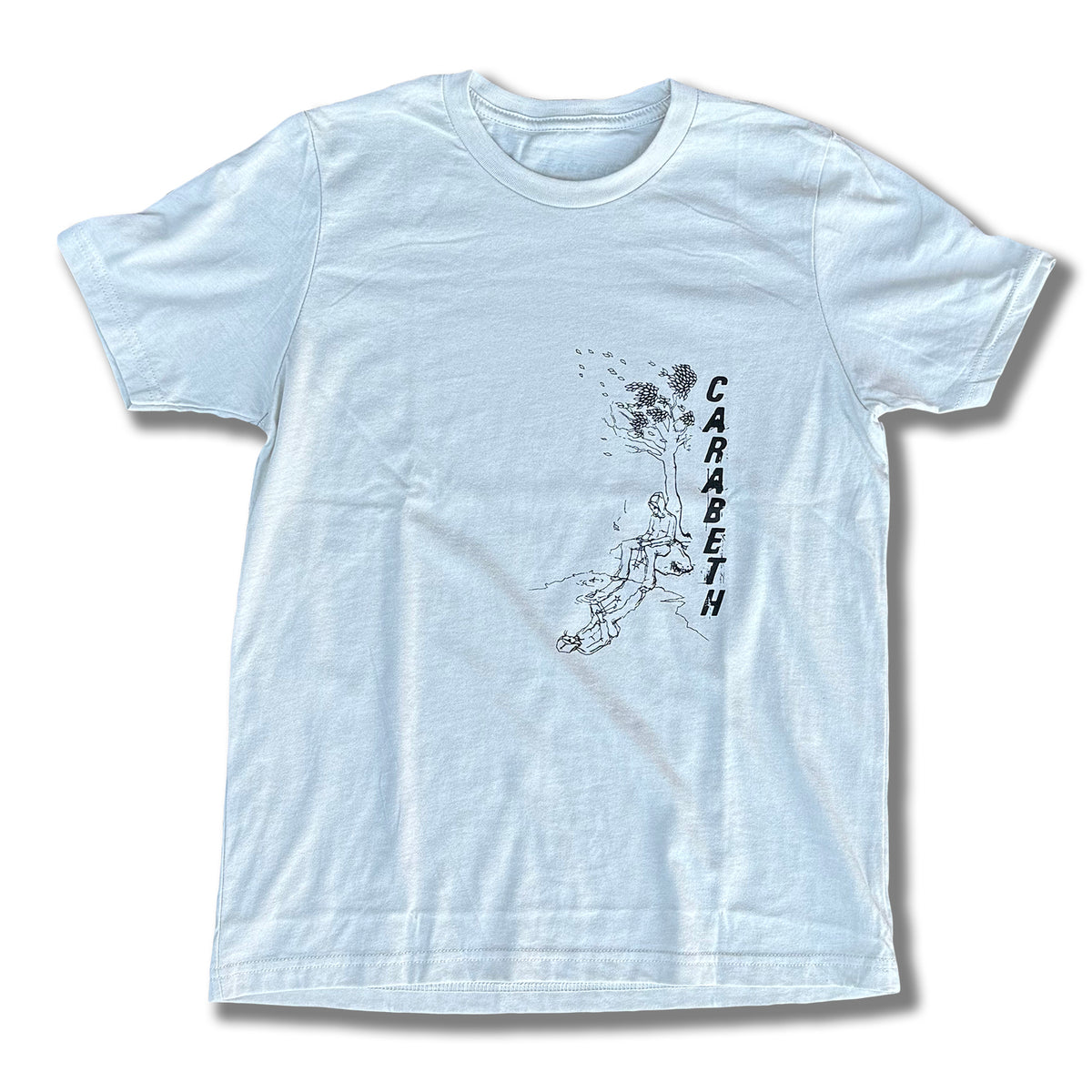 The CARABETH TREE OF LIFE T-shirt by MH Printing features a light blue bi-blend fabric, person on a swing beneath birds, and "CARABETH" printed vertically. Made in California.