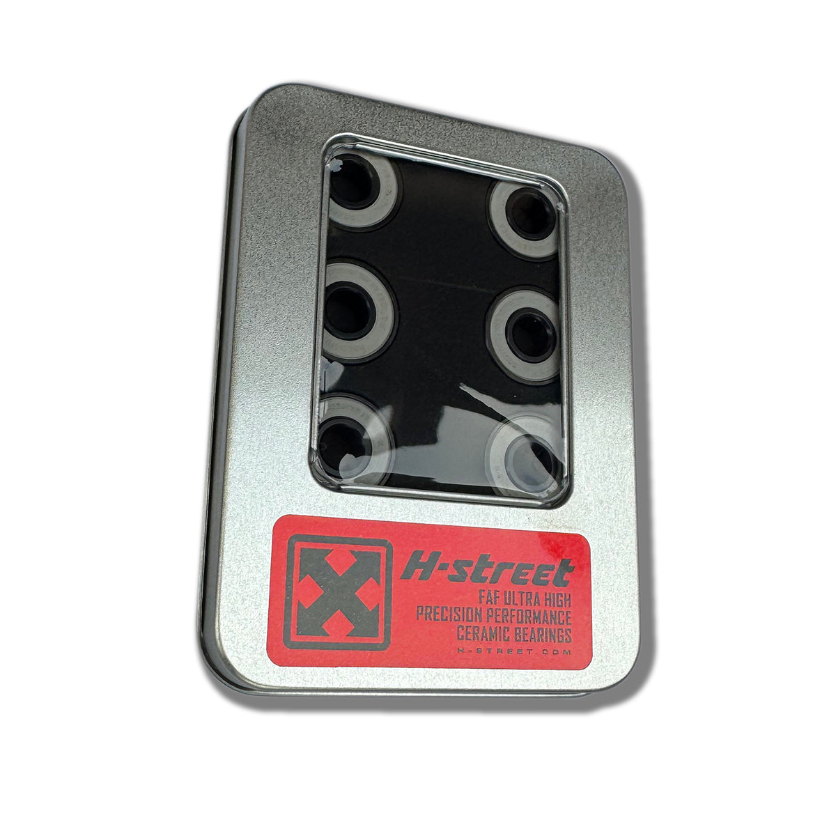 A rectangular metal tin with a clear window displays six black HST FAF BEARINGS by Art Function. The label features the product name and a red X logo.