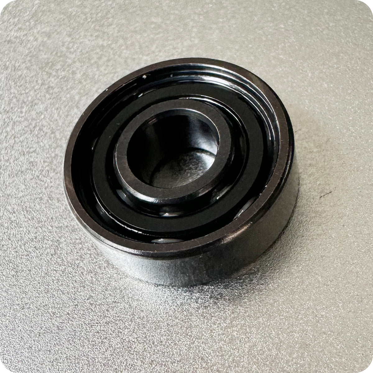 A close-up of the Art Function HST FAF Bearings shows the black metal, circular bearing with visible inner and outer rings on a textured gray surface.