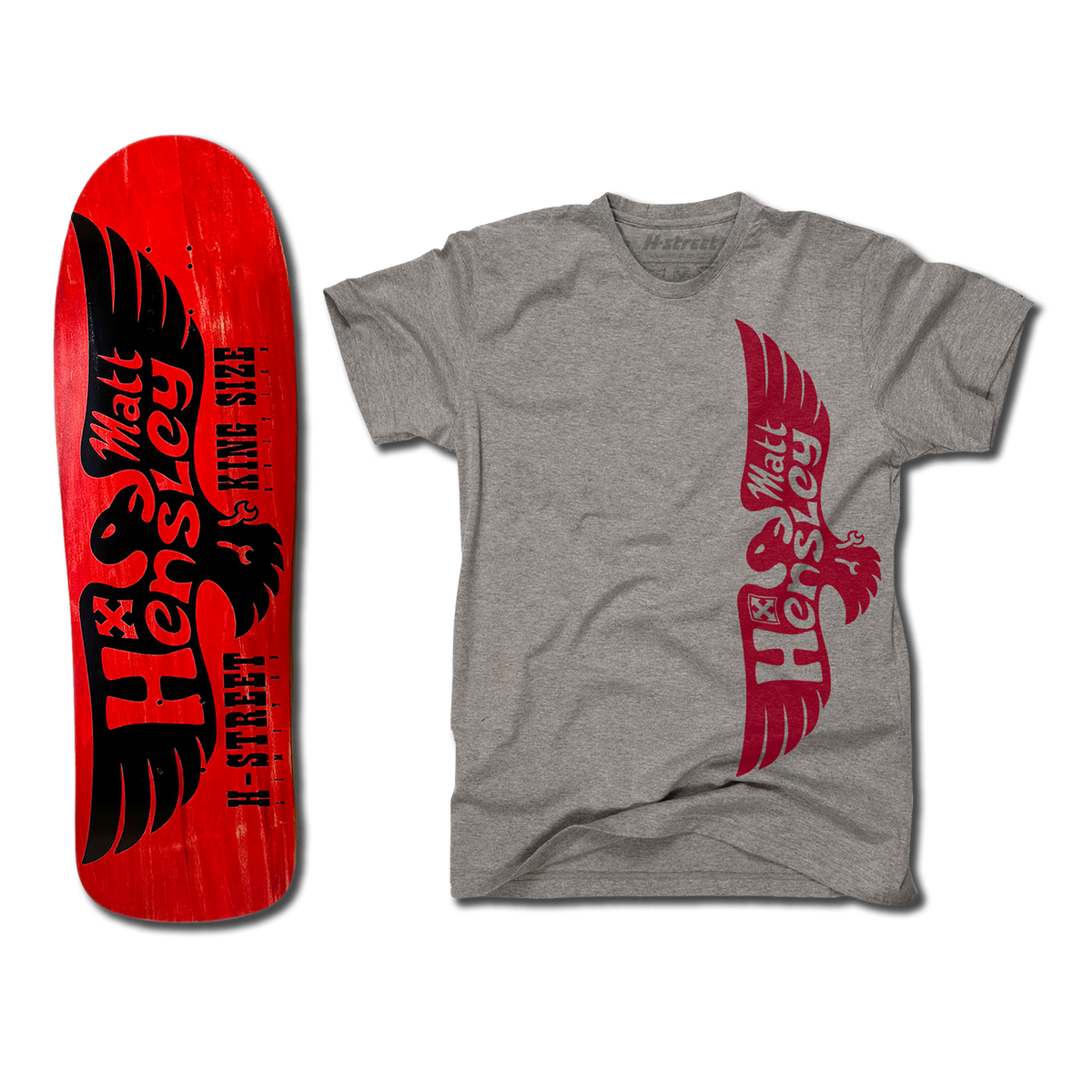 The bottom of a Hensley Eagle King Size Skateboard deck. The bottom is red with a black eagle. Next to it is a grey shirt with the red eagle logo on the front.