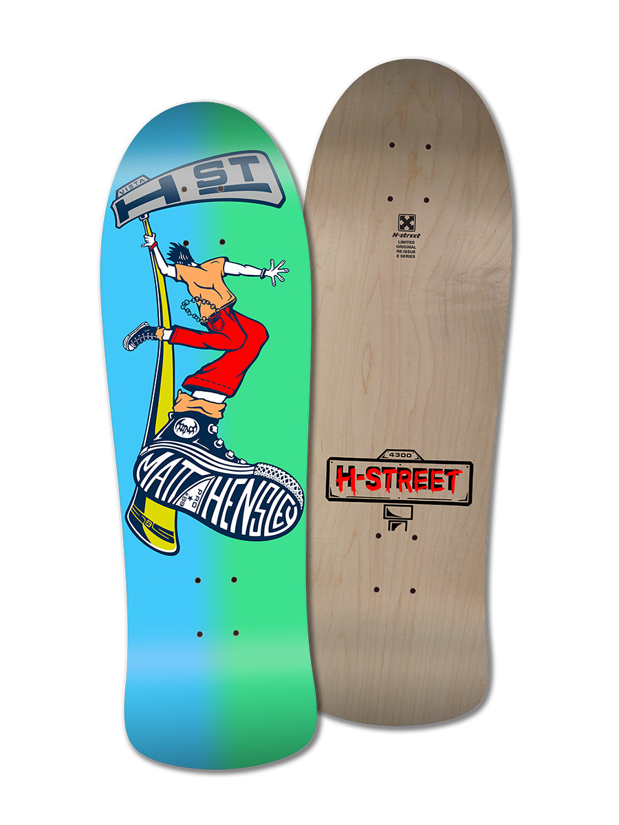 Two MATT HENSLEY STREET SWINGER E SERIES decks by Legend Skates are shown: the front displays vibrant cartoon skater art with “Matt Hensley” text and brand logos, while the back features plain wood and an H-Street logo—great for collectors.