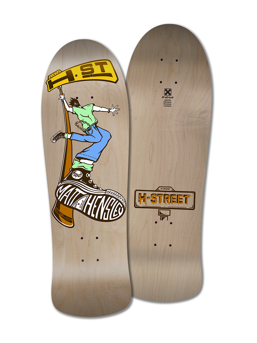 Two Legend Skates wooden decks: one MATT HENSLEY STREET SWINGER E SERIES collector re-issue with a colorful skater graphic and text, plus one deck displaying the classic H-Street logo on natural wood grain.