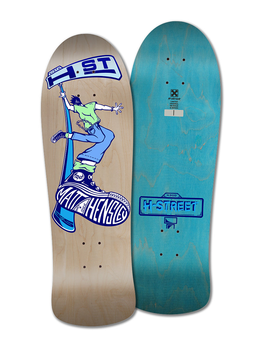 Two skateboard decks: a Legend Skates Matt Hensley Street Swinger G Series with a cartoon figure on a shoe, and another with plain light blue wood grain featuring classic H-Street branding.