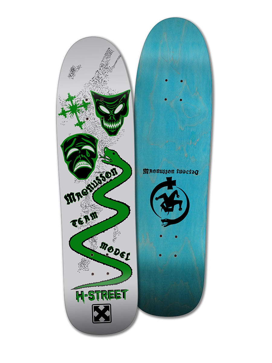 Two skateboard decks: the Woodchuck T-MAG MASKS & SERPENT featuring gray and green snarling face graphics, and a plain blue deck with a black logo and "Magnusson Sweden" text.