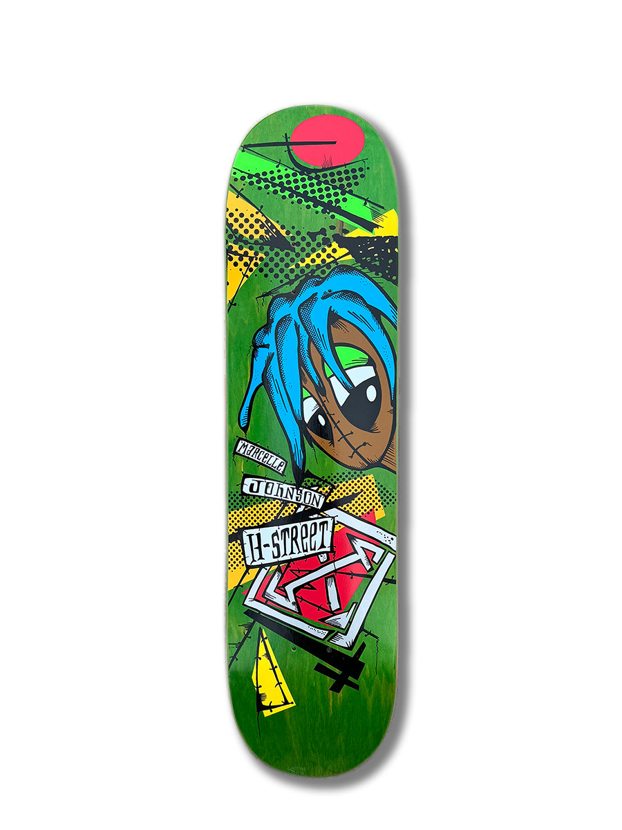 The Woodchuck MARCELLE JOHNSON TRIBUTE GRAPHIC deck showcases a green design with a blue-haired cartoon, bold H-STREET text, graffiti-style art, and abstract shapes—a true tribute to street skate culture.
