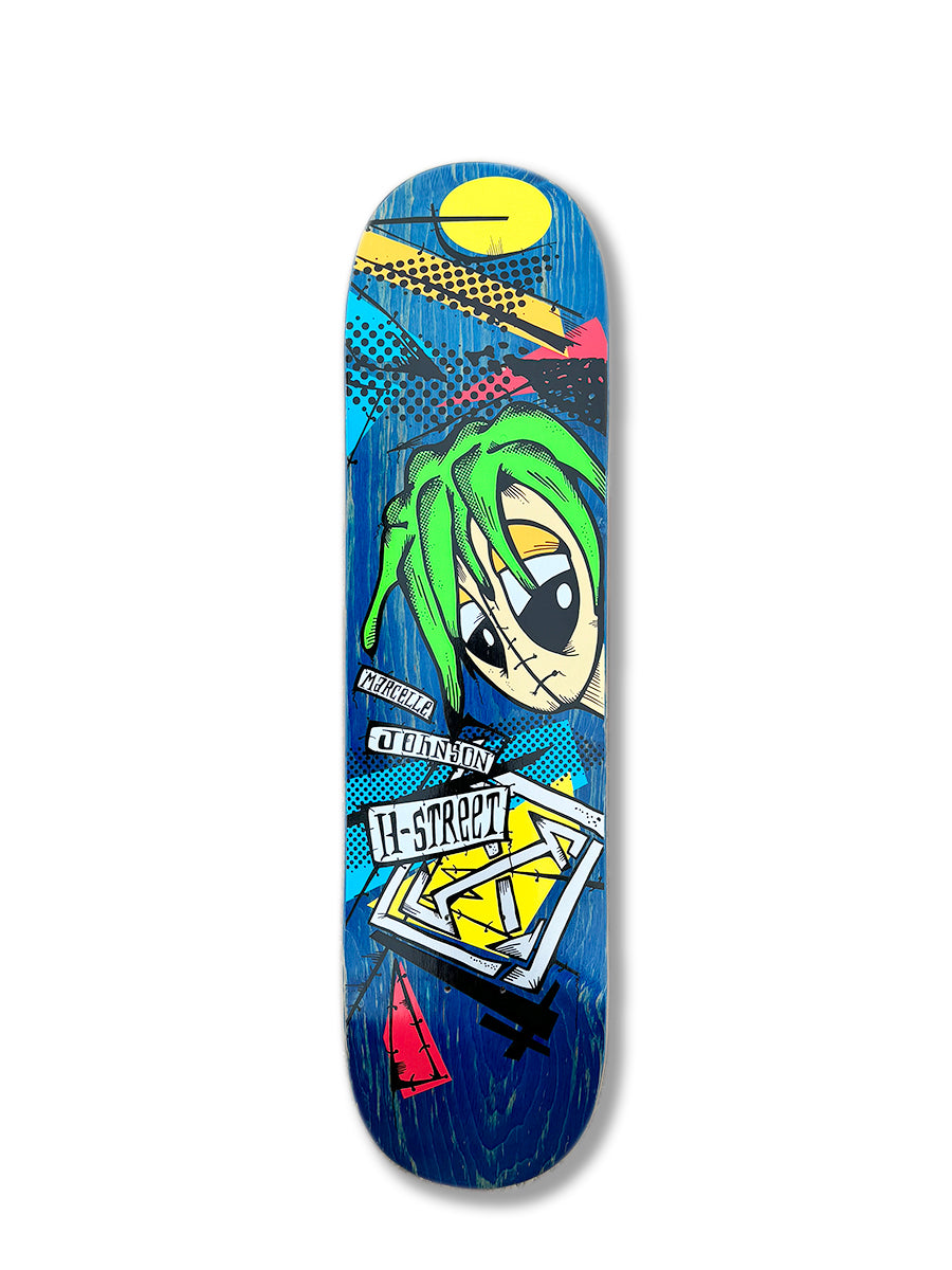 The Woodchuck MARCELLE JOHNSON TRIBUTE GRAPHIC skateboard deck features bold graffiti-style art on a blue background, with a green-haired cartoon character, geometric shapes, and H-STREET text—a tribute to classic street skating.