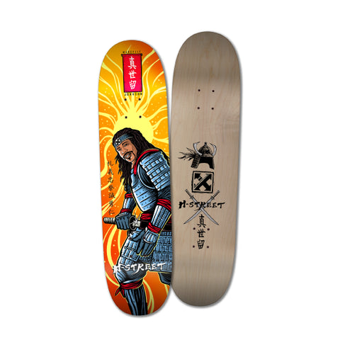 Skateboard deck with warrior illustration on one side and brand logo on the other, on a white background.