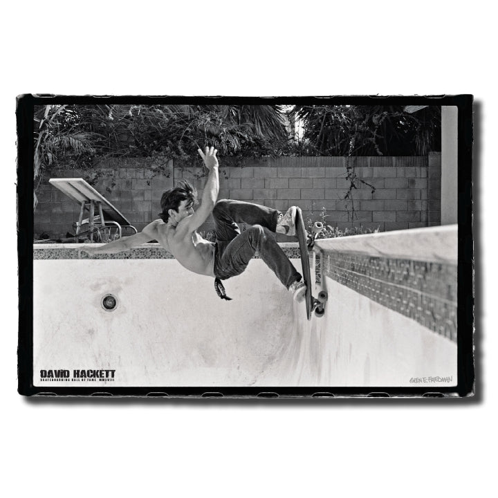 Black and white poster featuring a person skateboarding at a poolside, capturing a moment from the early pool skating movement.