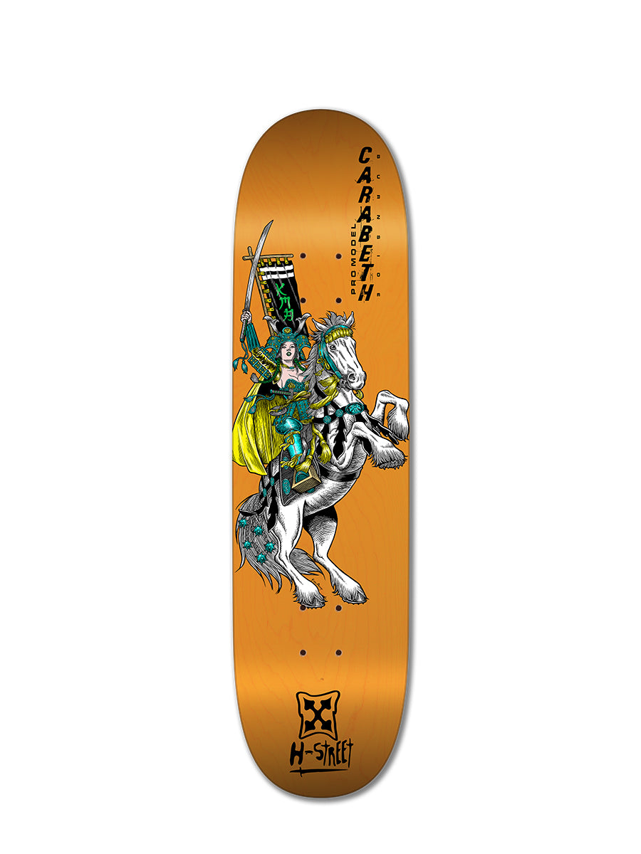 The Woodchuck CARABETH WARRIOR skateboard deck showcases a warrior in green and yellow armor on a white horse over an orange background, with "CARRABETH" and "H-STREET" celebrating CaraBeth Burnside and girls skateboarding.