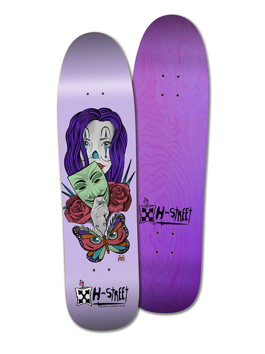 Two purple skateboards by Legend Skates: one features the ADDISON TAYLOR GIRL & BUTTERFLY DESIGN with a woman, mask, rose, and butterfly; the other has a plain purple woodgrain. Both display the H-Street logo.