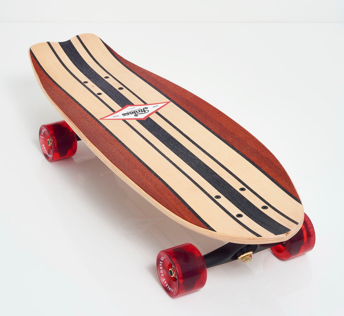 The FINLESS COMPLETE skateboard by Finless features a classic surfboard design with black stripes, red transparent wheels, and a centered logo, displayed on a white background.