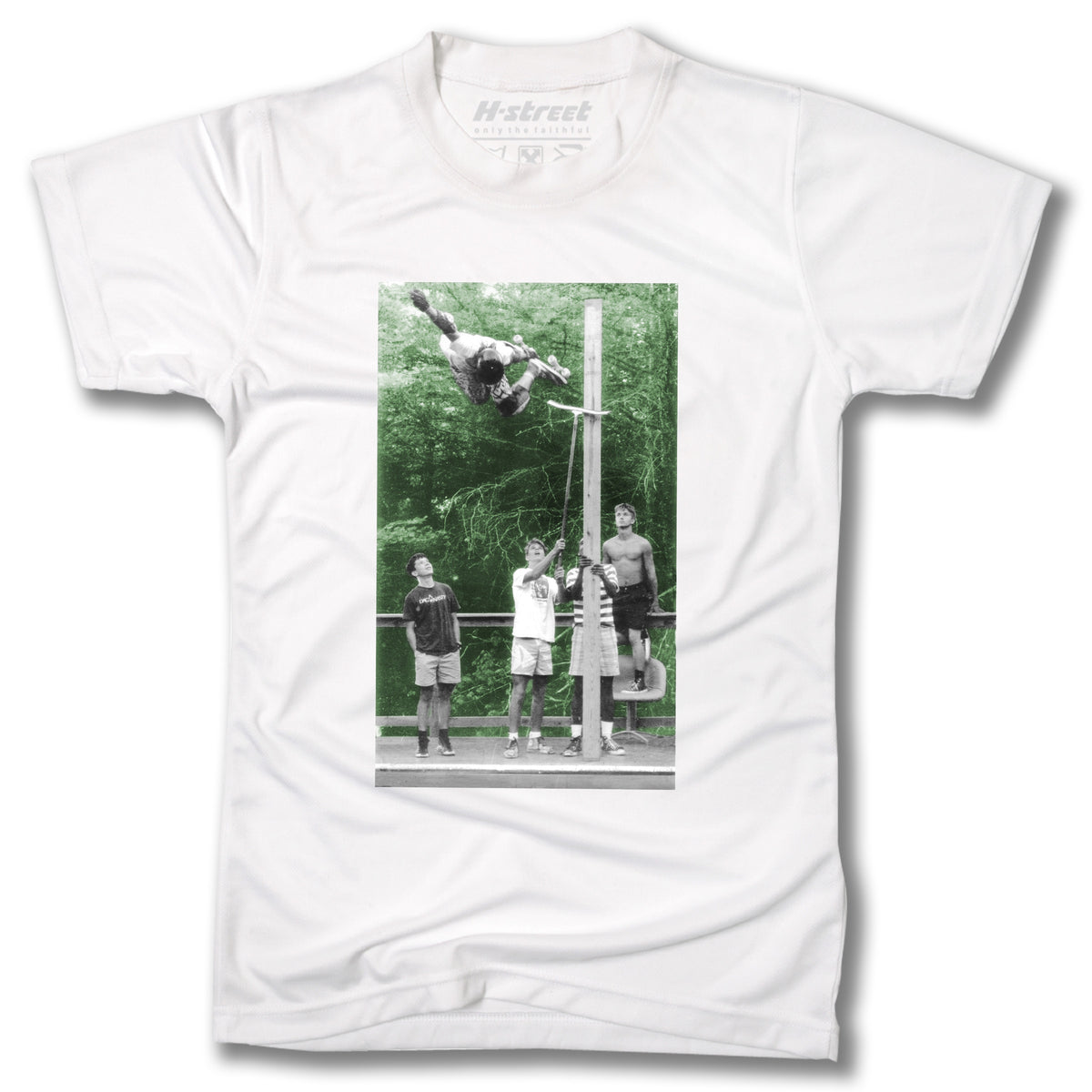 Minuteman's TONY MAG PHOTO TEE: A white T-shirt with a black and white photo of four people by a pole—one executing a high Backside Air, echoing iconic Cedar Crest Country Club skate sessions, with trees in the background.