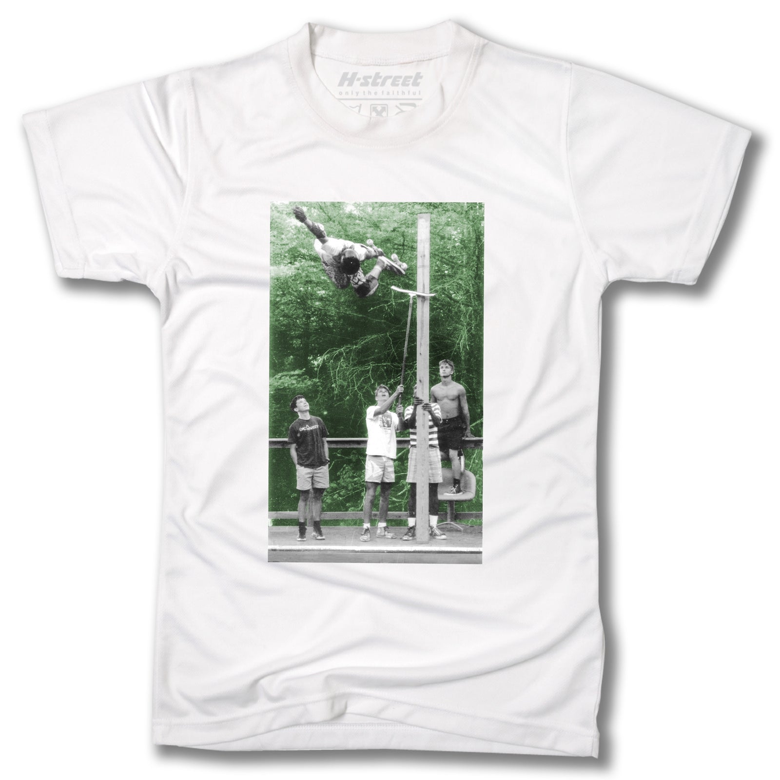 Minuteman's TONY MAG PHOTO TEE: A white T-shirt with a black and white photo of four people by a pole—one executing a high Backside Air, echoing iconic Cedar Crest Country Club skate sessions, with trees in the background.