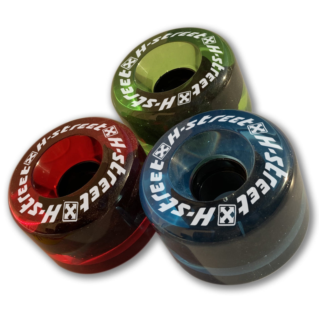 A set of three skateboard wheels in red, green, and blue colors, arranged vertically.