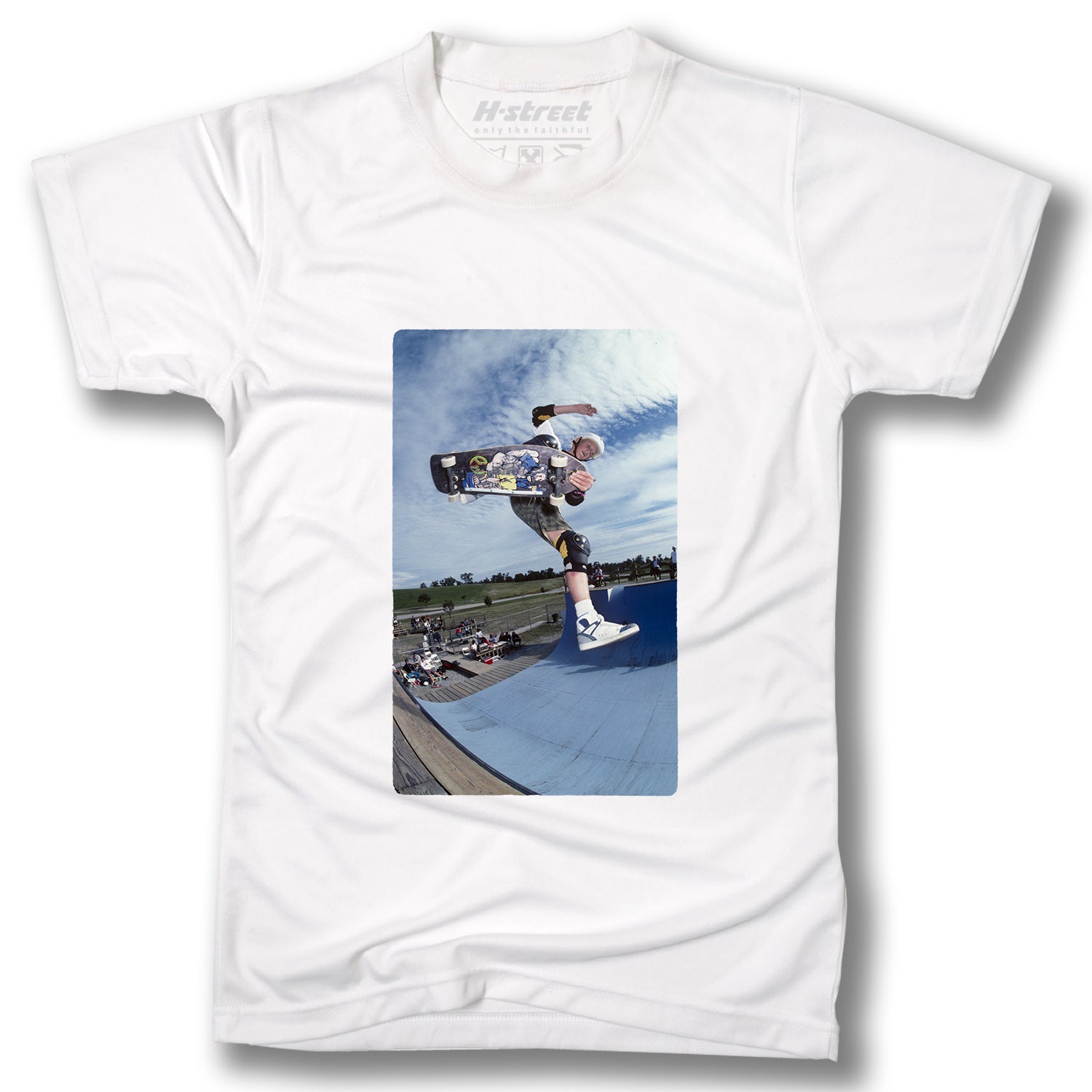The Minuteman DANNY WAY PHOTO TEE is a white T-shirt with a digital print of skateboard legend Danny Way doing an aerial trick on a blue ramp, perfect for skateboarding enthusiasts.