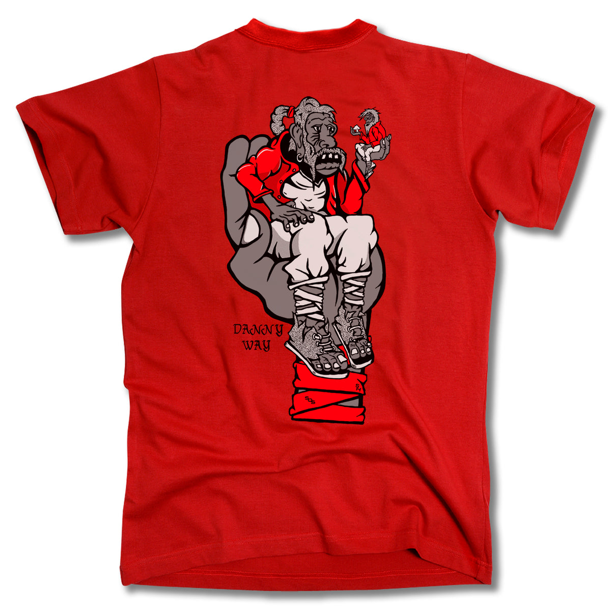 The Minuteman DANNY WAY GIANT TEE is a red ring-spun cotton shirt with a cartoon gorilla in a red jacket and boots sitting in a gray hand, plus "DANGUY WAY" beside the graphic. Inspired by the Danny Way Giant design.