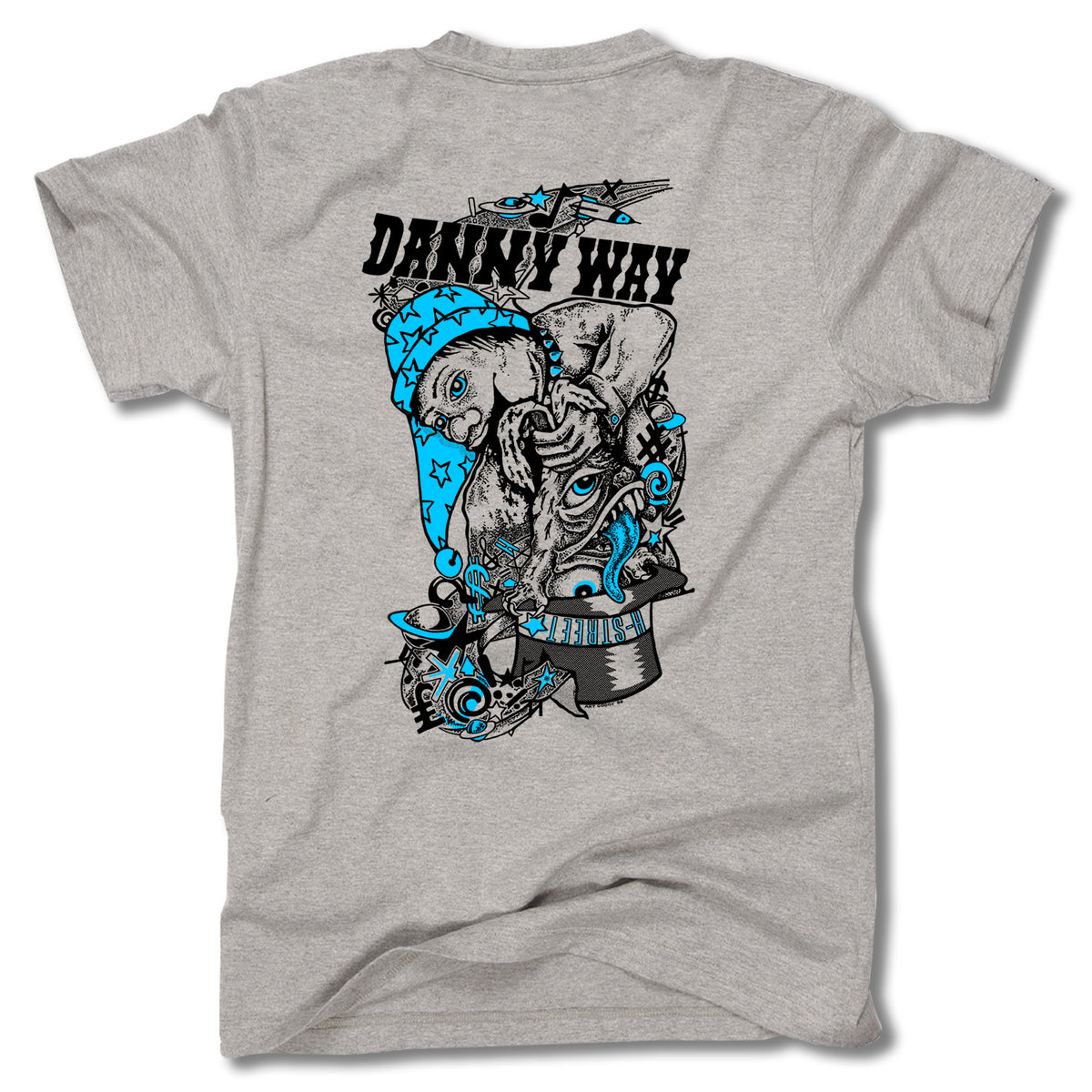 The Minuteman DANNY WAY RABBIT IN THE HAT TEE is a gray USA-made shirt with a bold back graphic: a surreal goat in a blue beanie amid stars and abstract art, offering a unique take on the classic Rabbit in the Hat design.