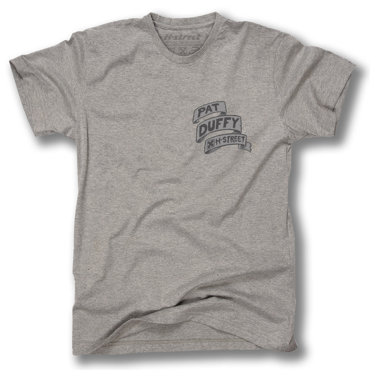 The Minuteman DUFFY BACK LIP TEE is a heather gray shirt with a small black chest graphic reading "Pat Duffy" and "H-Street" in stacked, banner style—a tribute to the legendary H-Street guest model. Shirt shown laid flat on white.