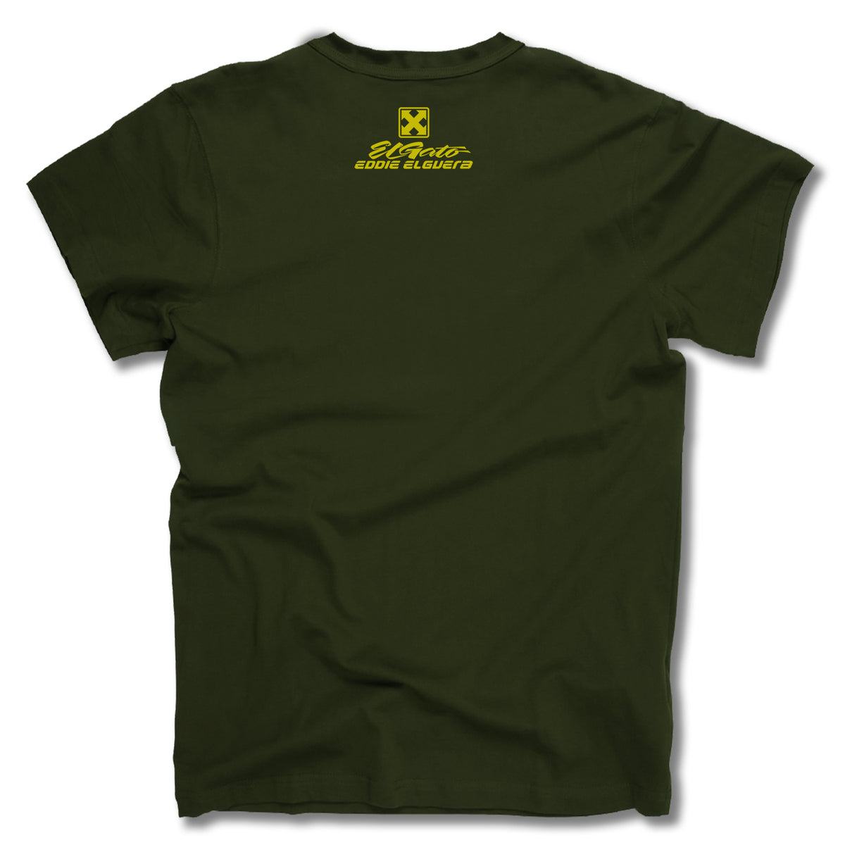 The Minuteman EDDIE ELGUERA EL GATO SCARECROW TEE is an olive green graphic tee made in the USA, featuring a small yellow “Wildstar Eddie Elguera” graphic on the upper back below the collar.