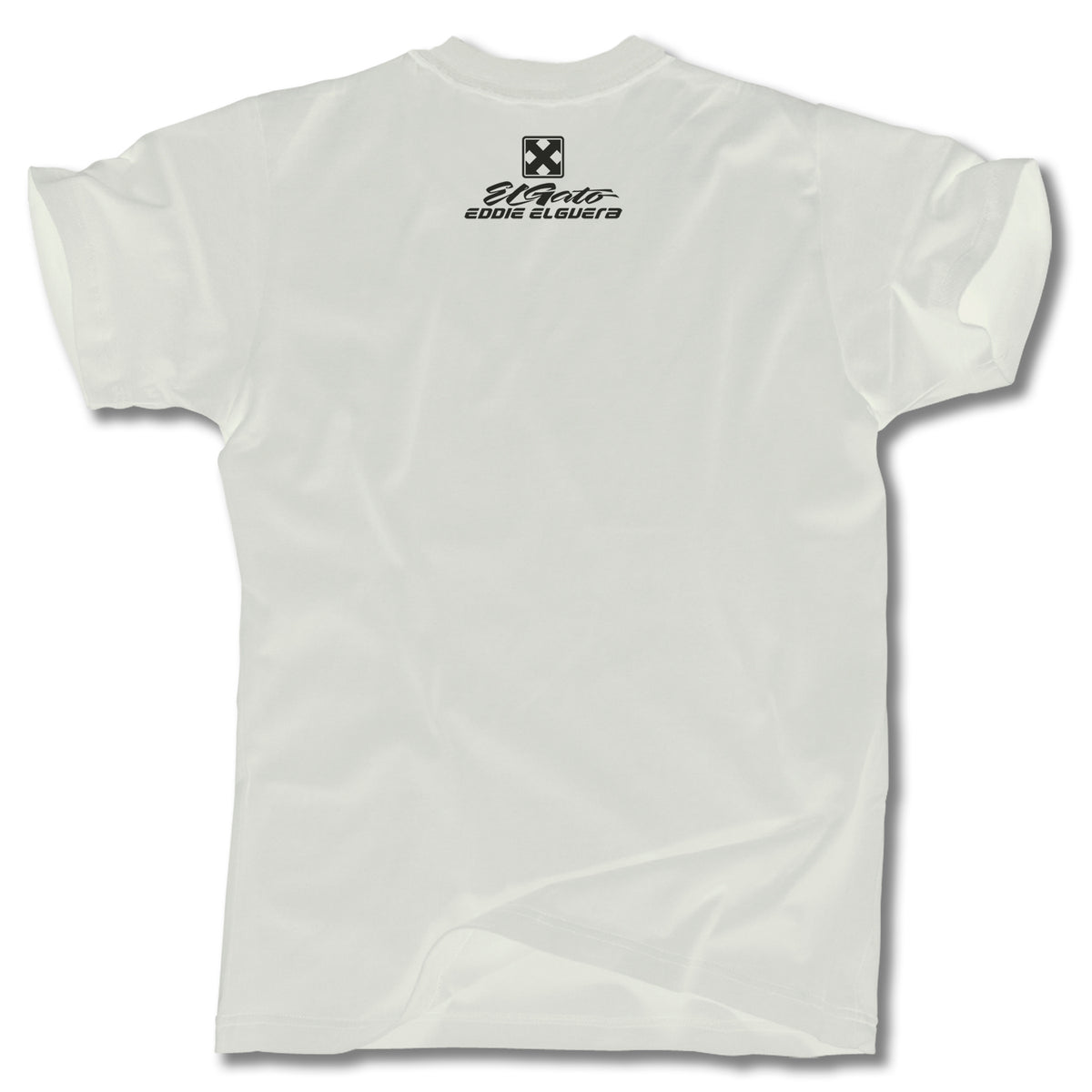 The Minuteman EDDIE ELGUERA EL GATO SCARECROW TEE is a plain white tee shown from the back, with a small black logo and text below the neckline. Most of the graphic tee is blank. Made in USA.