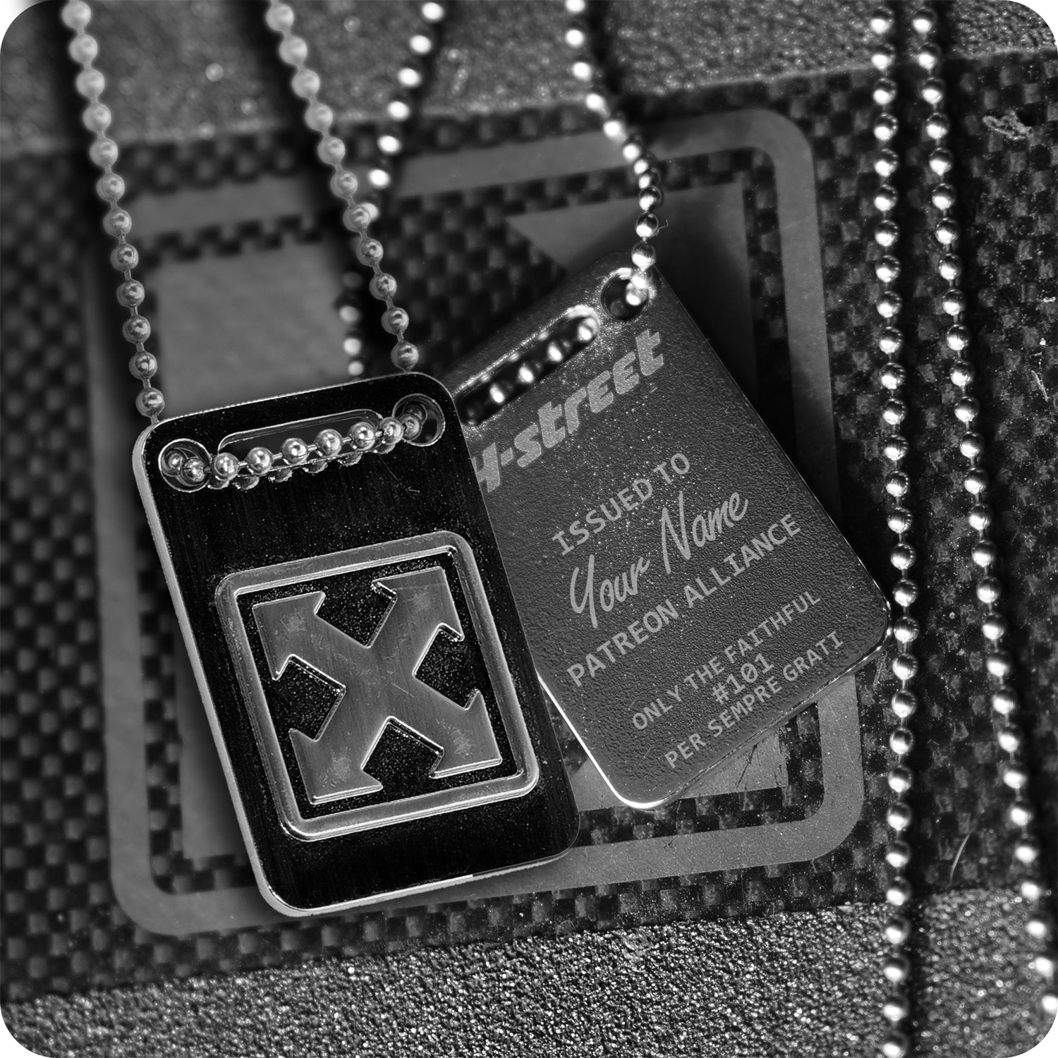 The H-STREET PATREON ALLIANCE DOG TAG by China Factory features two metallic tags on ball chains—one with the bold H-Street mark logo, the other custom engraved with "ISSUED TO Your Name" and "PATREON ALLIANCE.