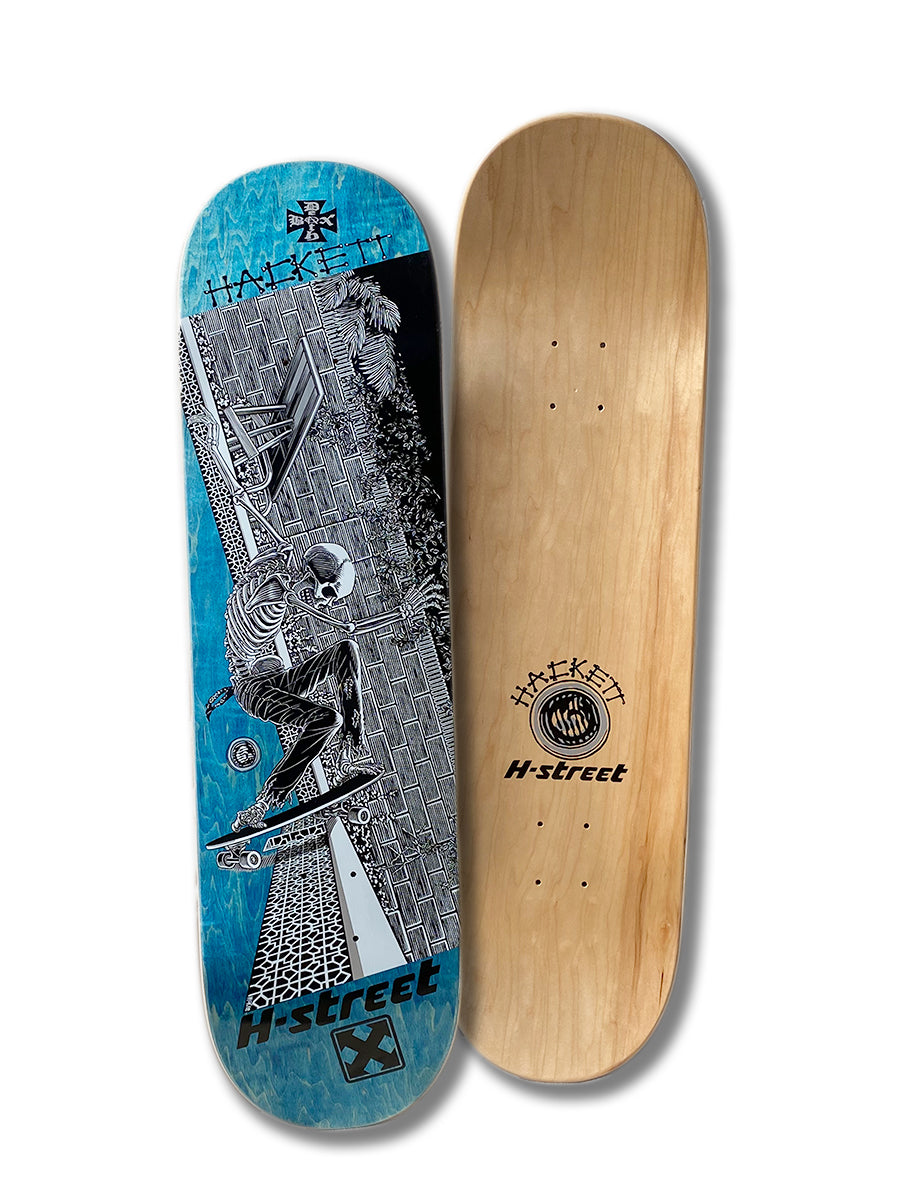 Two DAVE HACKETT SLASH STREET skateboard decks by Perfect Skateboarding: one with blue/black Marc McKee skeleton skate art, H-Street and Hackett labels; the other is plain wood with a Hackett H-Street logo.