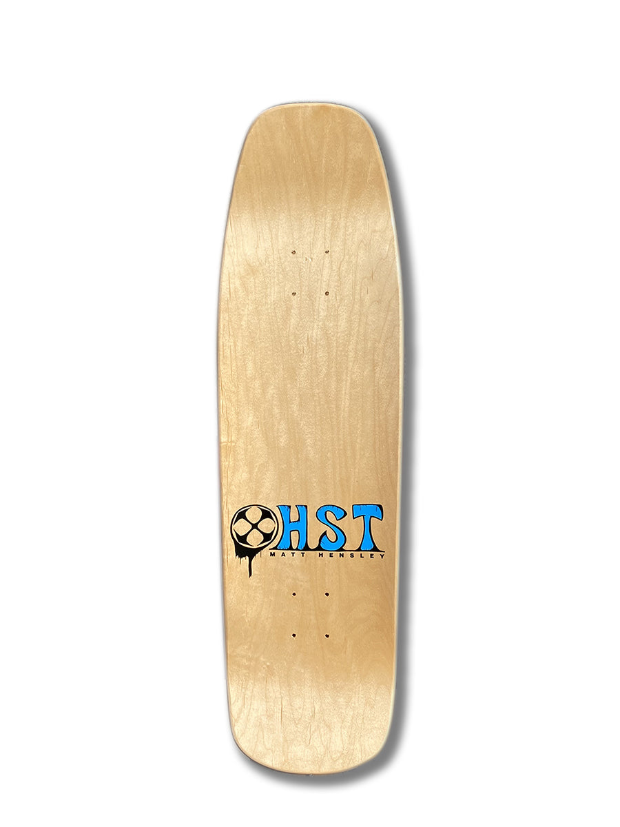 The Woodchuck HENSLEY X HICKMAN GUEST ART PARK&POOL is a wooden skateboard deck with a natural finish, squared nose and tail, no grip tape, and a small black and blue logo near the bottom—classic H-Street style inspired.