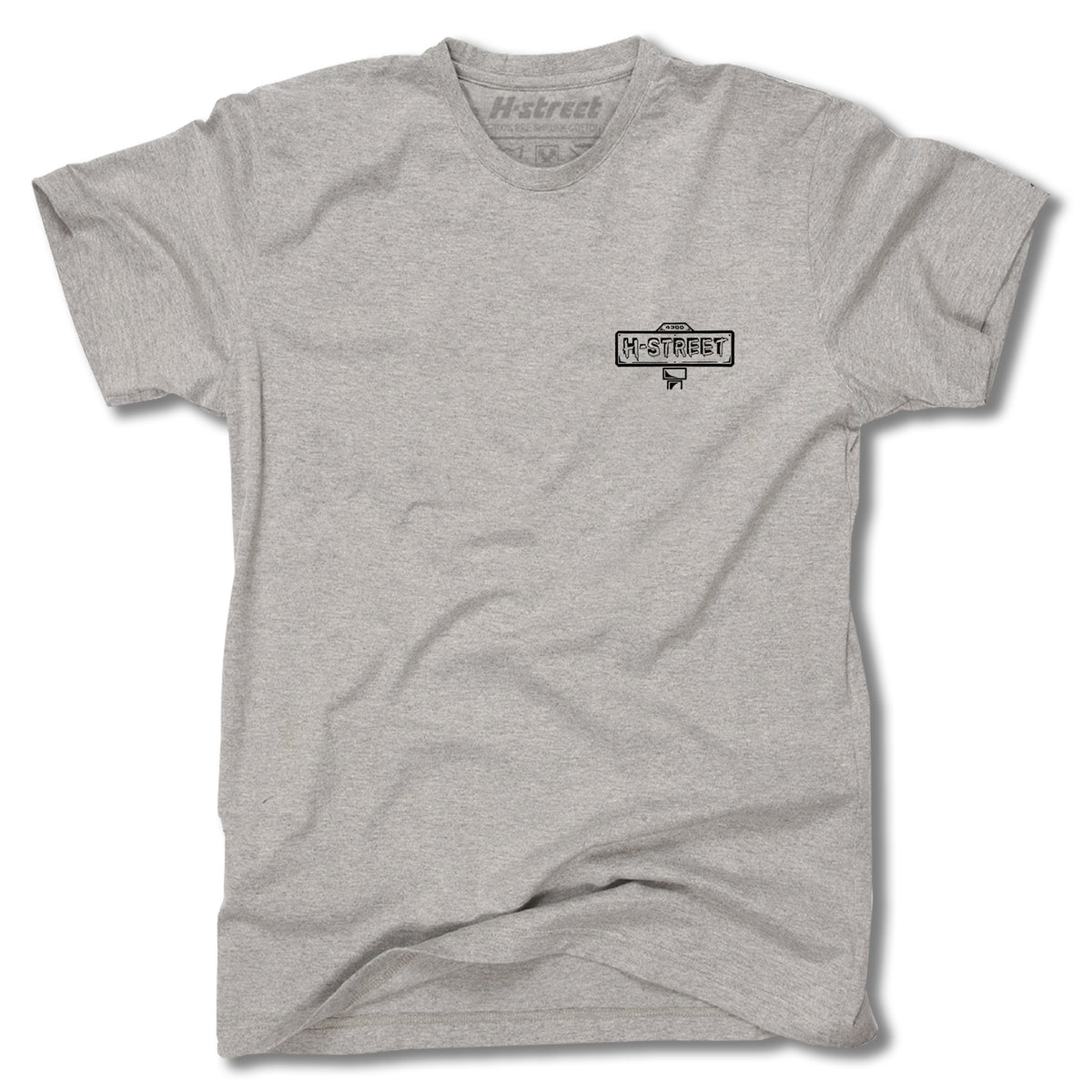 The Minuteman MATT HENSLEY STREET SWINGER TEE is a gray short-sleeved shirt with a small black H-Street logo and street sign graphic on the left chest, displayed laid flat on a white background.