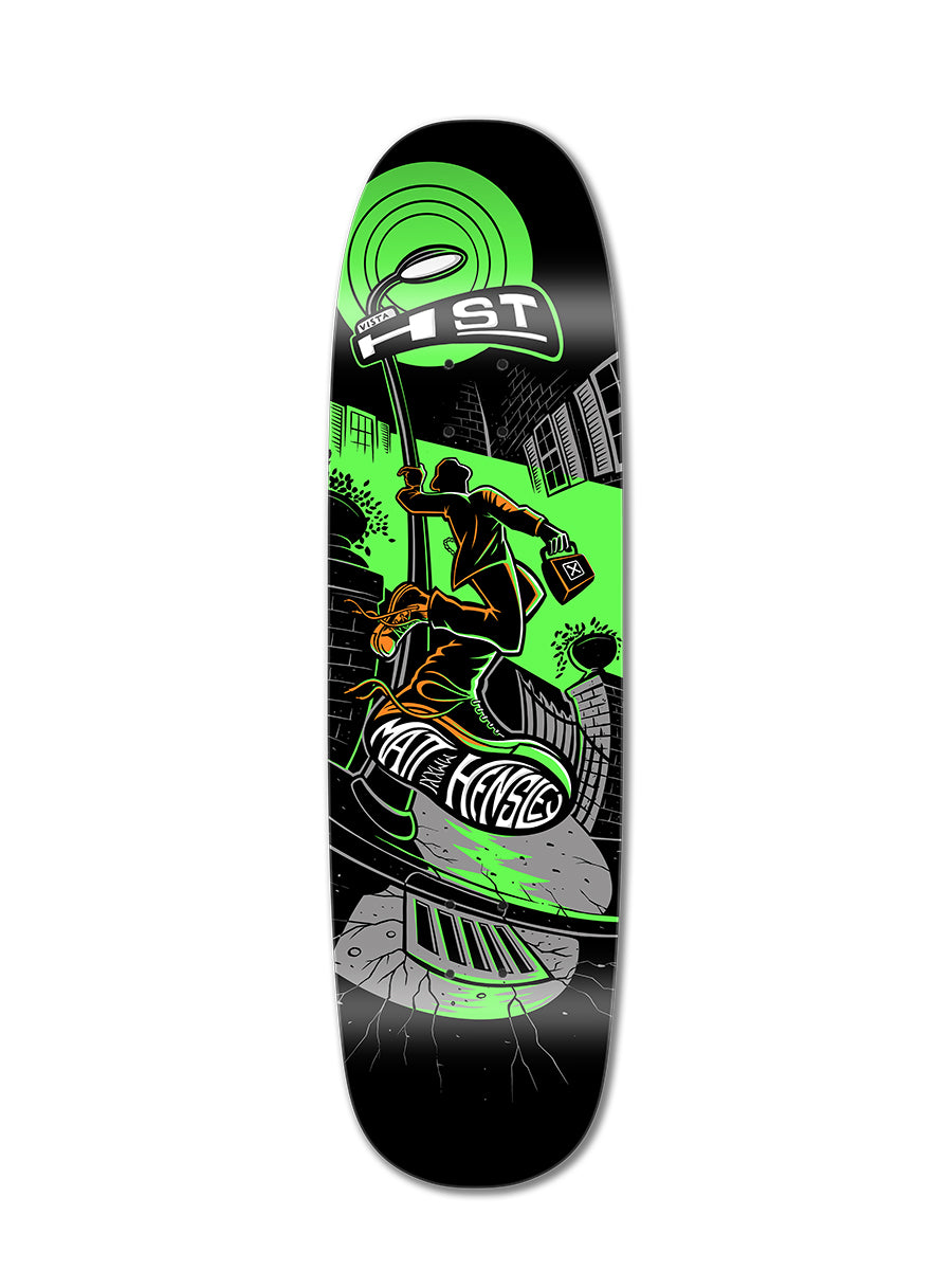 The HENSLEY X BARON STREETSWINGER deck by Perfect Skateboarding features neon green and orange graffiti art of a skater in a cityscape, holding a spray can, with urban elements and "RESIST" above.