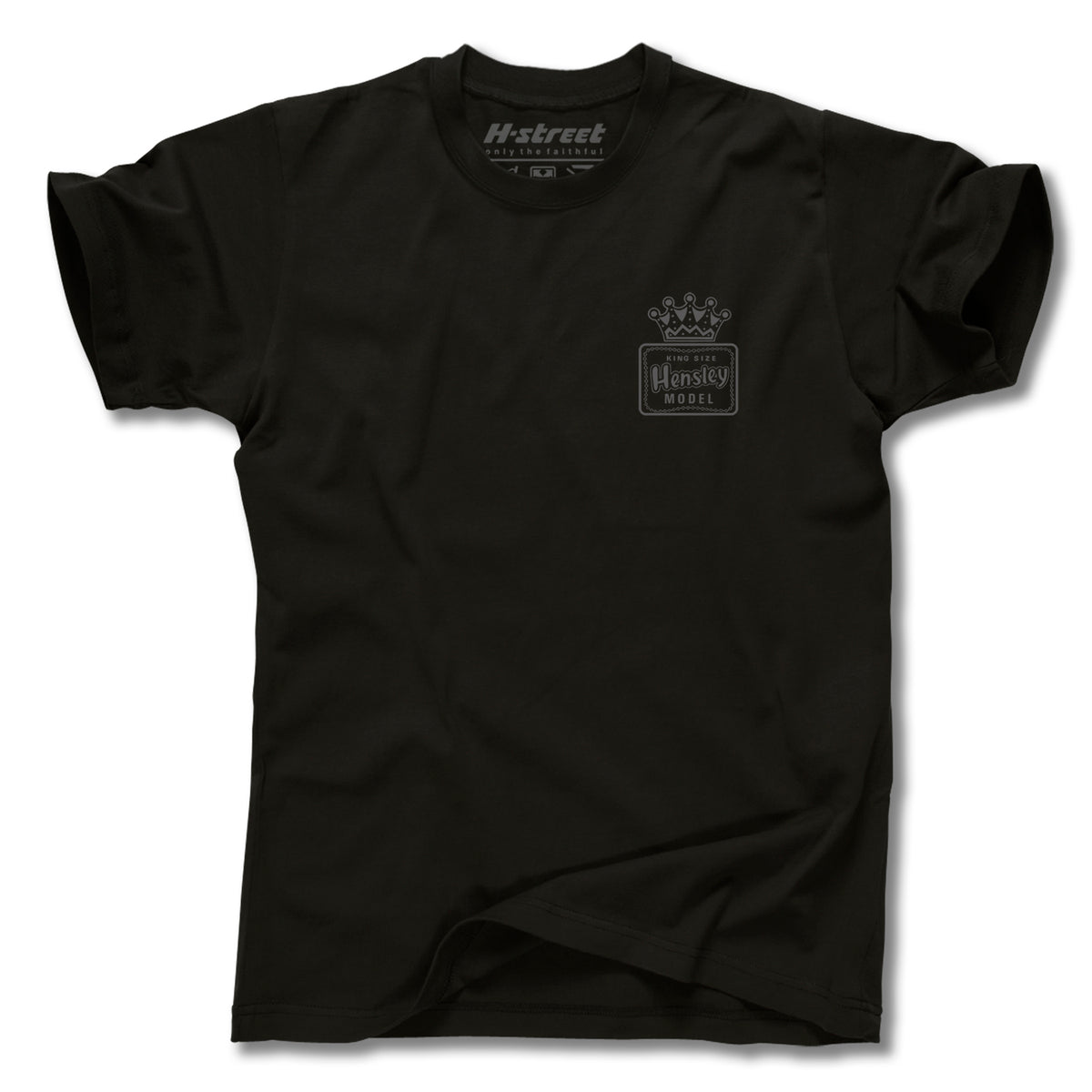 The Minuteman MATT HENSLEY KINGSIZE HORNBLOWER TEE is a black short-sleeve graphic tee with a small light logo and crown on the left chest and the brand name inside the collar.