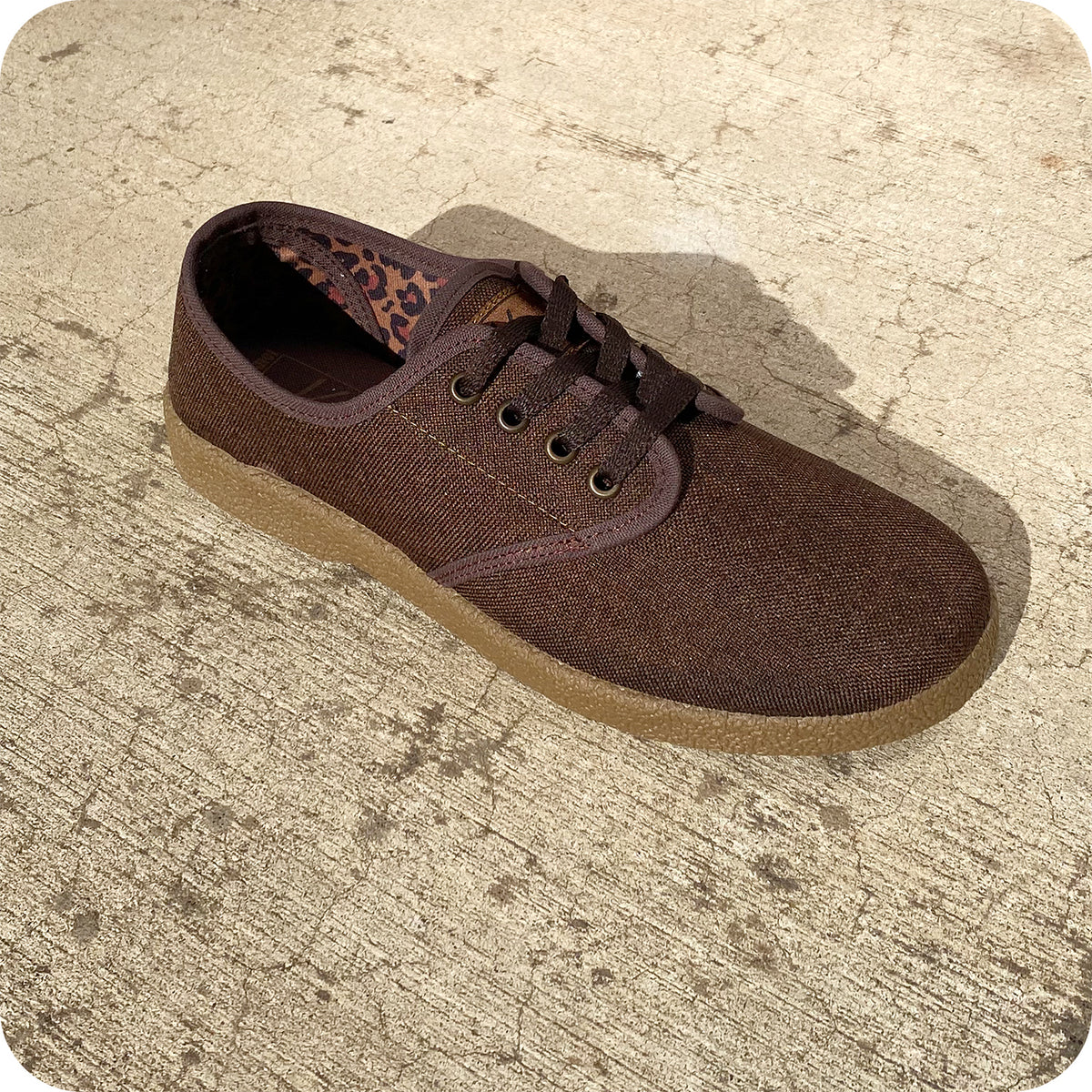 The Kingston Union Mfg COFFEE BROWN WINO features a coffee brown canvas upper, dark brown laces, a tan rubber sole, and leopard print inner lining—perfect as a stylish lifestyle shoe.