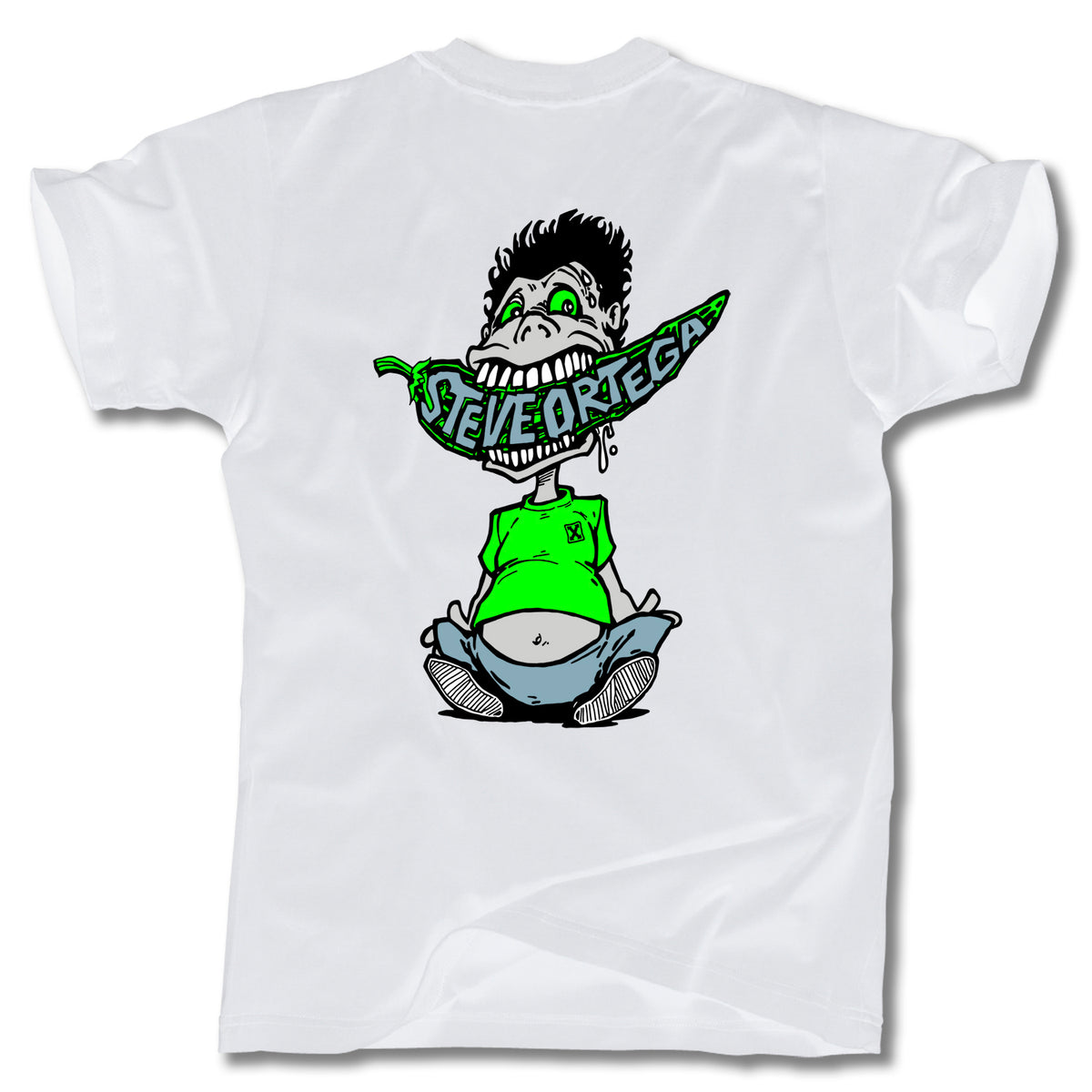 The Minuteman STEVE ORTEGA CHILI TEE is a white T-shirt with a cartoon graphic of Steve Ortega biting a green chili pepper. Made in the USA.