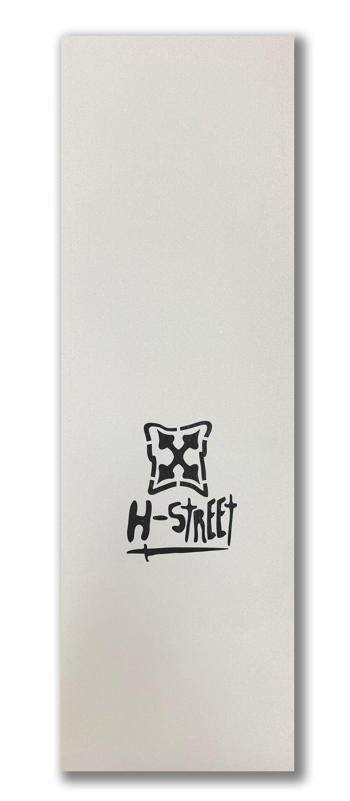 A white rectangular surface with a black, spray paint stencil-style abstract symbol above “Syndrome” in a stylized font at the center, resembling classic ALPHA GIRL LOGO DIECUT GRIPTAPE by Syndrome for skateboard grip tape enthusiasts.
