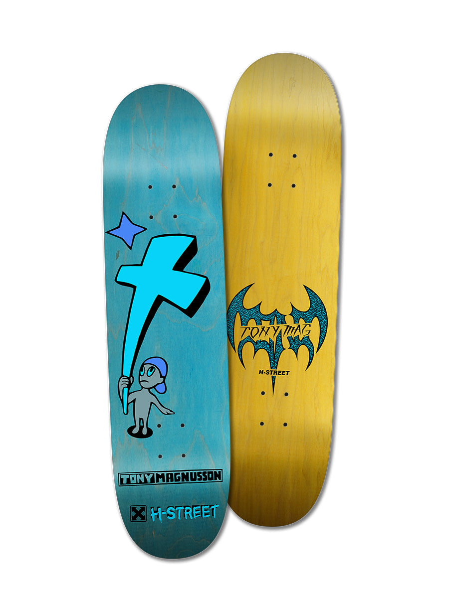 Two skateboard decks: the Perfect Skateboarding TONY MAG KID'N'CROSS deck features a blue character holding a cross on Canadian Hardrock Maple; the other is yellow with a bat graphic and TONY MAG and H-STREET logos.