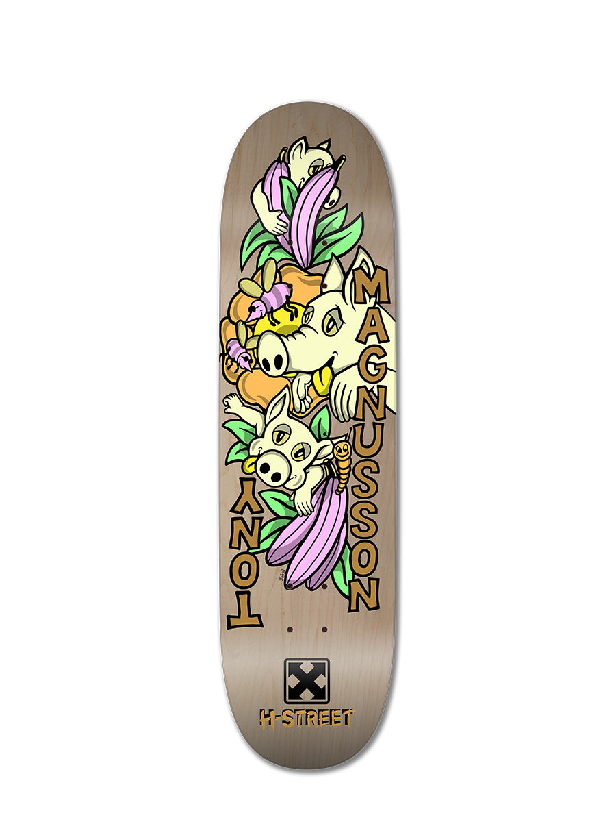 The T-MAG LOVE PIGGIES by Woodchuck is a limited edition skateboard deck with colorful cartoon cows and bananas, bold yellow “Tony Magnusson” lettering, the M-Street logo, and a playful light wood grain background.