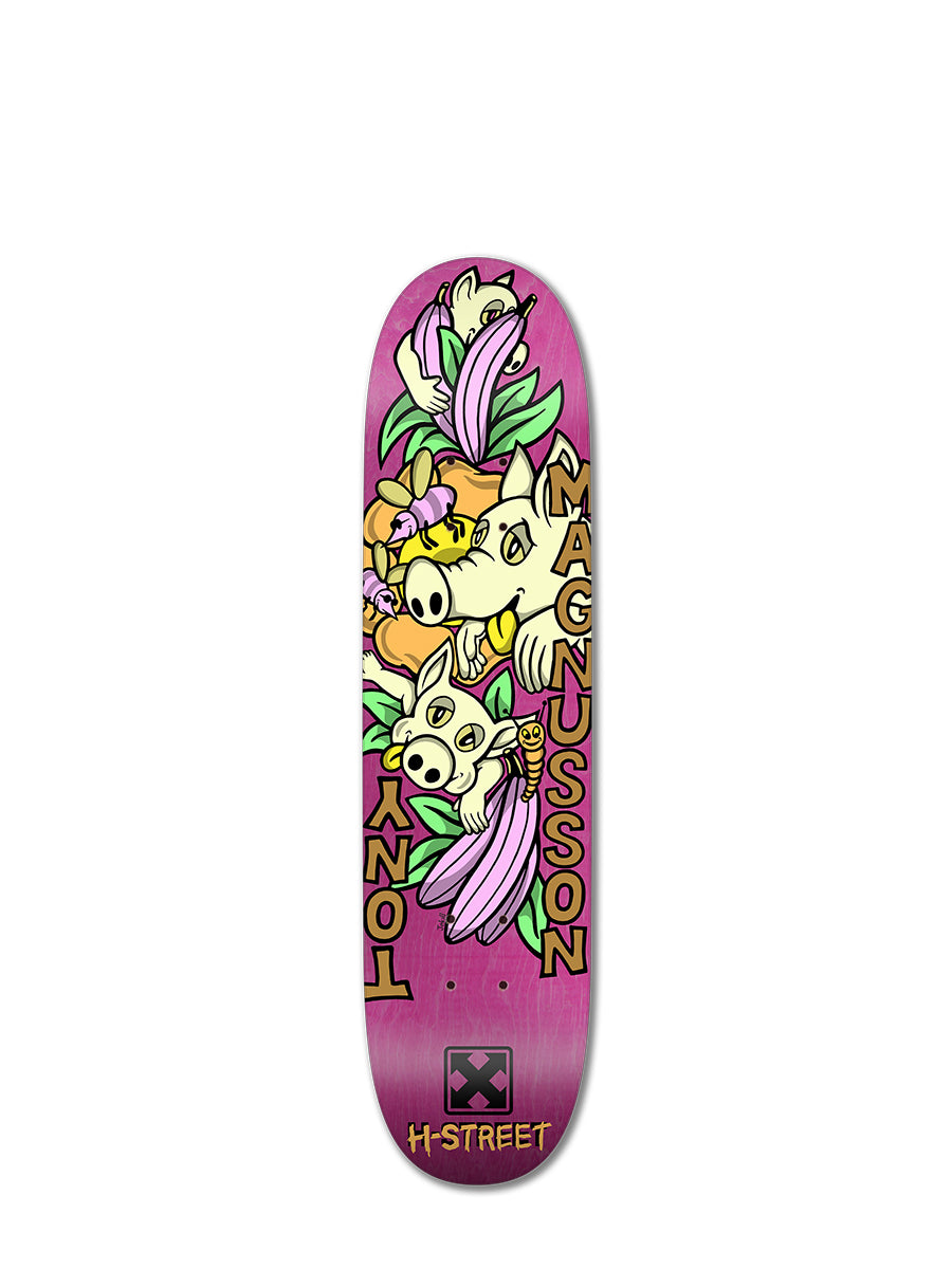 The Woodchuck T-MAG LOVE PIGGIES is a limited edition mini pro skateboard deck with a pink background, cartoon boar heads, purple flowers, and green leaves, plus bold vertical lettering and yellow accents.
