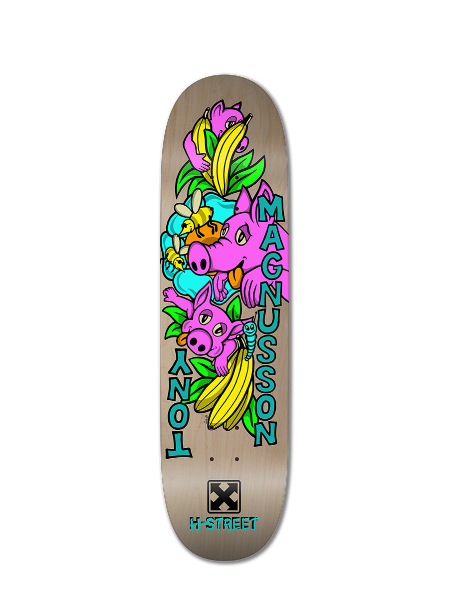 The Woodchuck T-MAG LOVE PIGGIES is a limited edition mini pro skateboard deck with cartoon pigs, bananas, green leaves, bold TONY and MAGNUSSON lettering, and M-STREET at the bottom—a true collector’s piece.