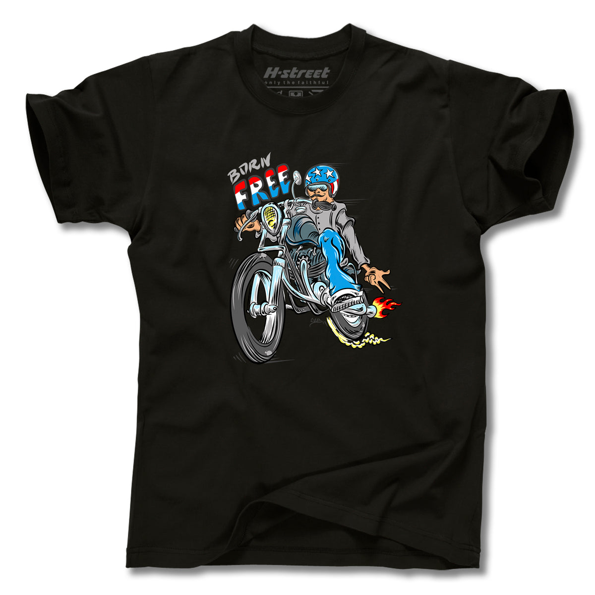 The Minuteman TONY MAG BORN FREE TEE features exclusive skateboard art: a cartoon motorcyclist with a star-spangled helmet, flaming exhaust, and "Born Free" above. Part of the Tony Mag Born Free collection.
