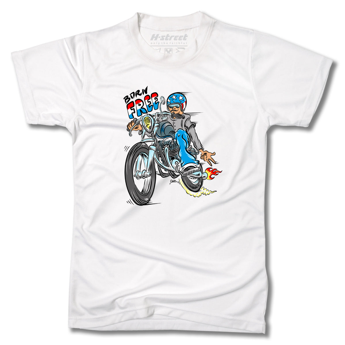 The TONY MAG BORN FREE TEE by Minuteman features a cartoon graphic of a rider in blue gear doing a wheelie, with “BORN FREE!” above—skateboard art inspired.