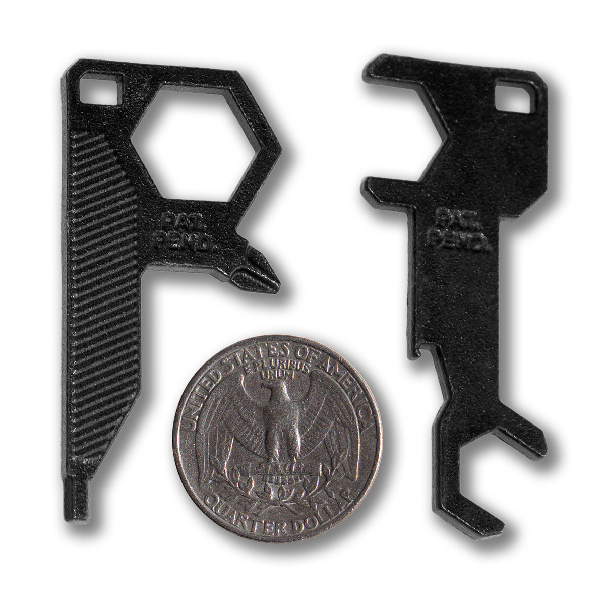 Two small black Art Function TITAN SKATE TOOL multitools are shown beside a U.S. quarter for scale. Each tool features an angular design with hexagonal openings, notched edges, and "PAT PEND" text visible on the surface.