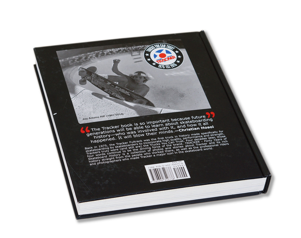 The back cover of the TRACKER TRUCKS 40TH ANNIVERSARY BOOK by TRACKER features a black-and-white photo of a skateboarder mid-air, the Tracker logo, and text celebrating Tracker Trucks' influence on skateboarding history.
