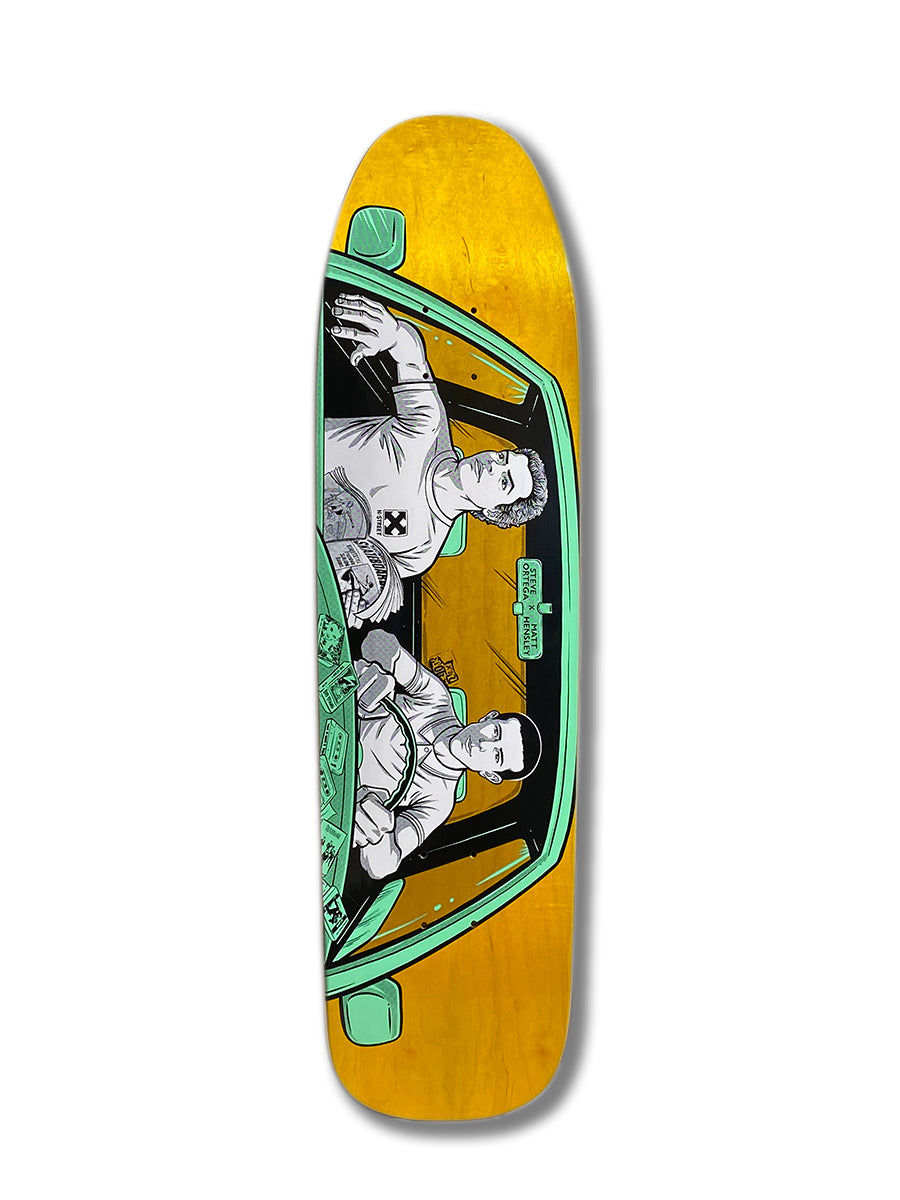 The Woodchuck HENSLEY X ORTEGA VISTA B SERIES skateboard deck features a yellow background with two OG Vista crew men driving a car, seen from the hood, green interior, and items scattered on the dashboard.